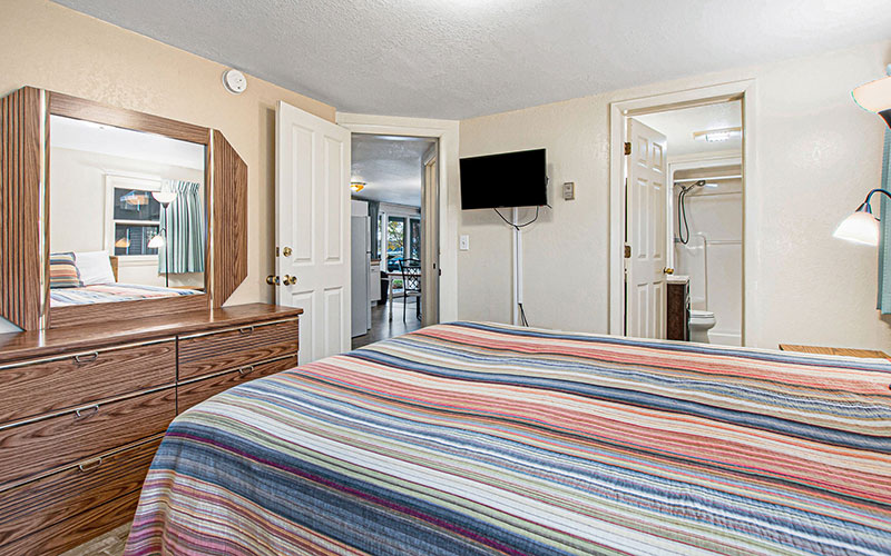 queen bedroom in pentwater rental suite at channel lane inn